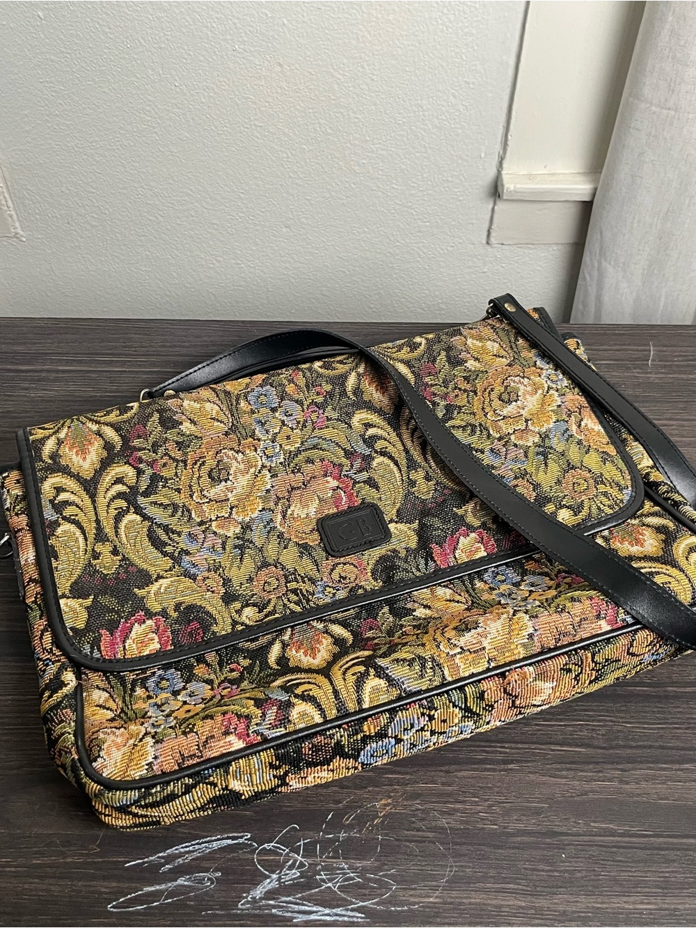 Geoffrey Beene messenger bag ft vibrant floral tapestry ext & black leather trim